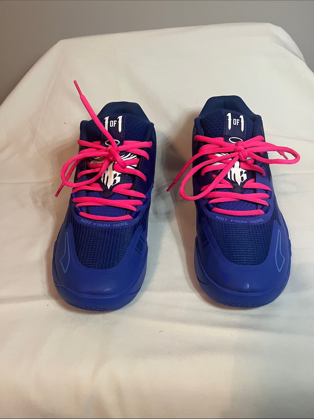 Puma mens Melo Athletic Shoes in Blue with Pink Laces